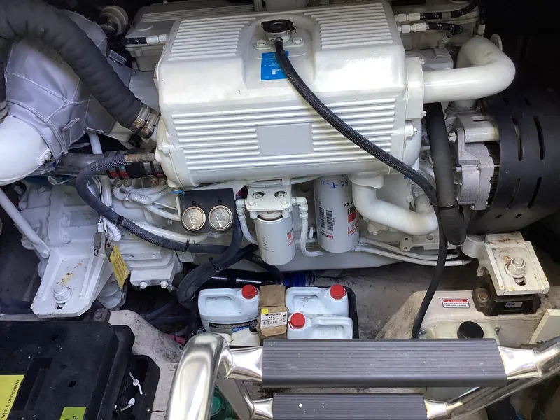 Slide: The Image of Engine compartment of a 2006 Sea Ray 48 Sundancer yacht, showcasing mechanical components. - 29