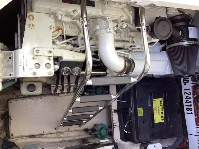 Slide: The Image of Engine compartment of a 2006 Sea Ray 48 Sundancer with visible components and battery box. - 34