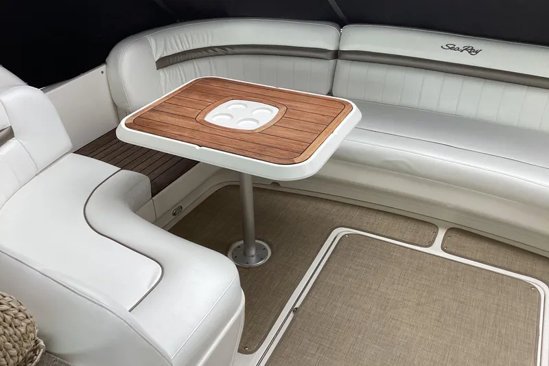 Slide: The Image of Luxurious seating area on 2006 Sea Ray 48 Sundancer yacht with elegant wooden table. - 37