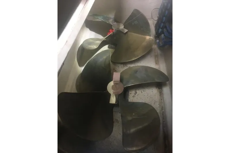 Slide: The Image of 2006 Sea Ray 48 Sundancer interior with elegant wooden table and white seating. - 42