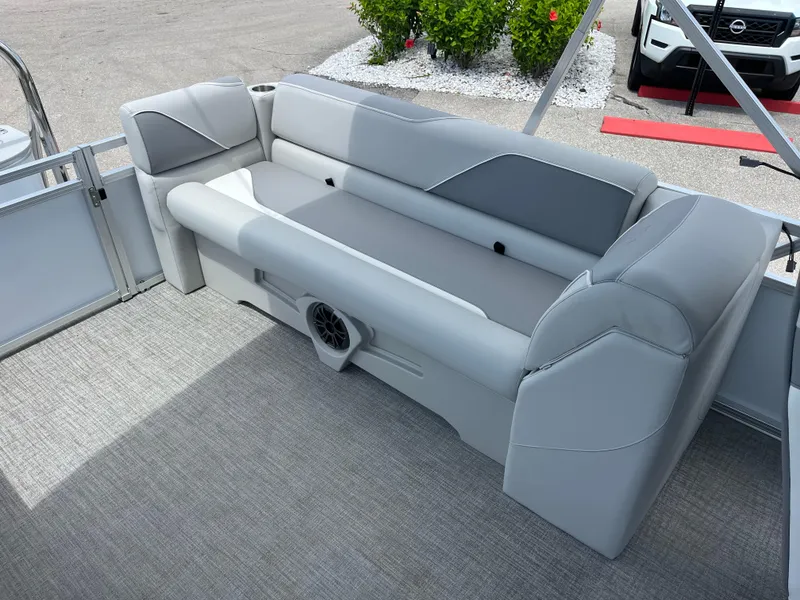Slide: The Image of 2025 Avalon 2385 Venture 85 Quad Lounger interior with gray seating and speaker. - 19