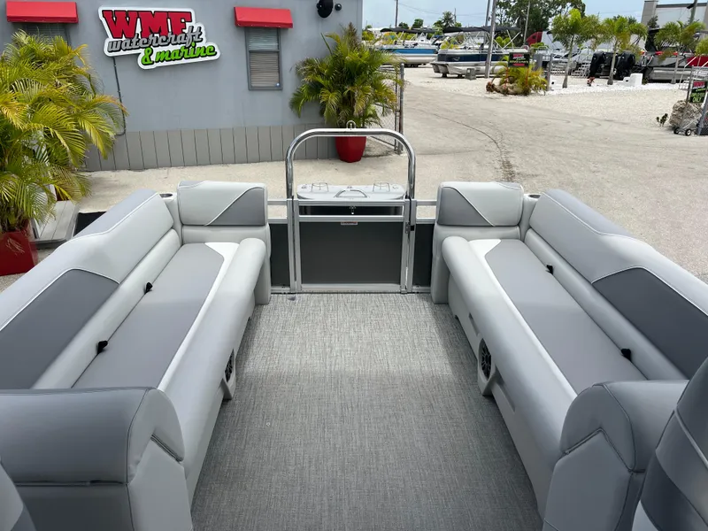 Slide: The Image of 2025 Avalon 2385 Venture 85 Quad Lounger interior with gray seating at WMF Watercraft & Marine. - 17
