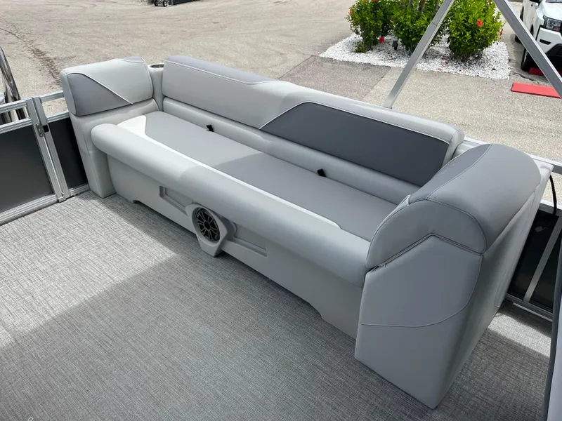 Slide: The Image of 2025 Avalon 2385 Venture 85 Quad Lounger interior with gray seating and speaker. - 19