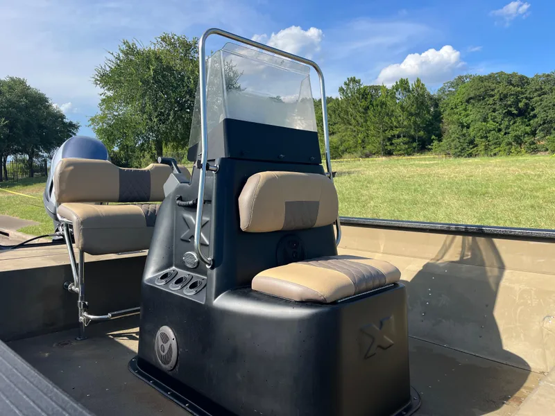 Slide: The Image of 2011 G3 2072cc boat console with steering wheel and navigation equipment. - 10