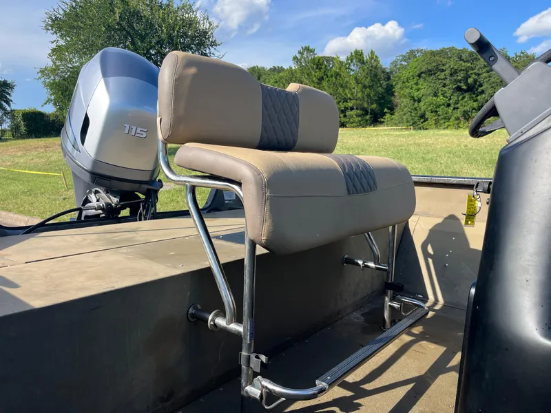 Slide: The Image of 2011 G3 2072cc boat interior with seating and console, set against a grassy landscape. - 11