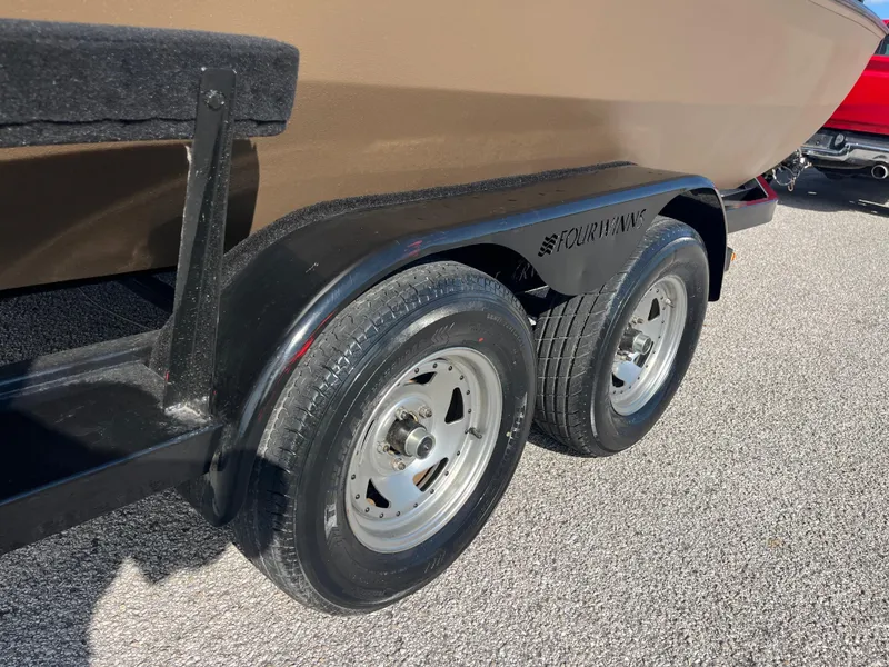 Slide: The Image of ```markdown
Silver outboard motor with "115" label, G3 2072cc model, 2011, against a grassy landscape.
``` - 18