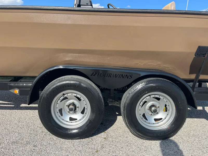 Slide: The Image of Dual-axle trailer with G3 2072cc boat, 2011 model, on asphalt surface. - 19