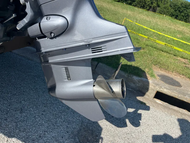 Slide: The Image of Boat motor on a G3 2072cc, 2011 model, with clear blue sky background. - 21