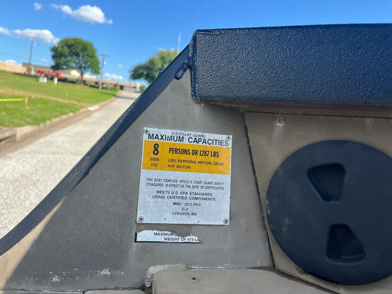 Slide: The Image of Silver Yamaha four-stroke outboard motor against a clear blue sky. - 24