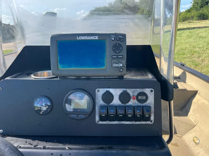 Slide: The Image of 2011 G3 2072cc boat interior with steering console and seating. - 29