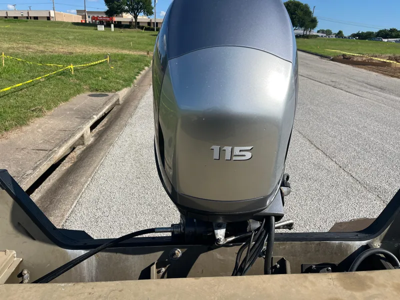 Slide: The Image of Boat dashboard with Lowrance GPS, Yamaha tachometer, and control switches on a 2011 G3 2072cc. - 30