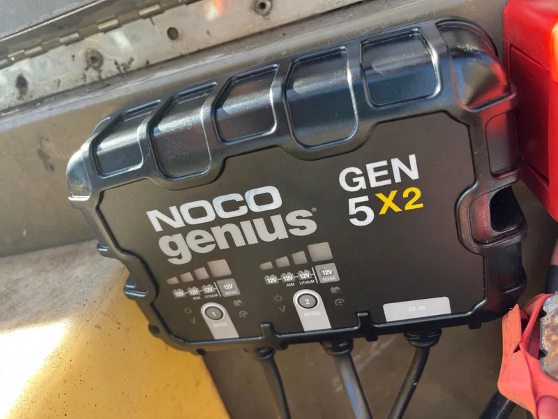 Slide: The Image of Outboard motor on a G3 2072cc boat, model year 2011, parked on a street. - 31