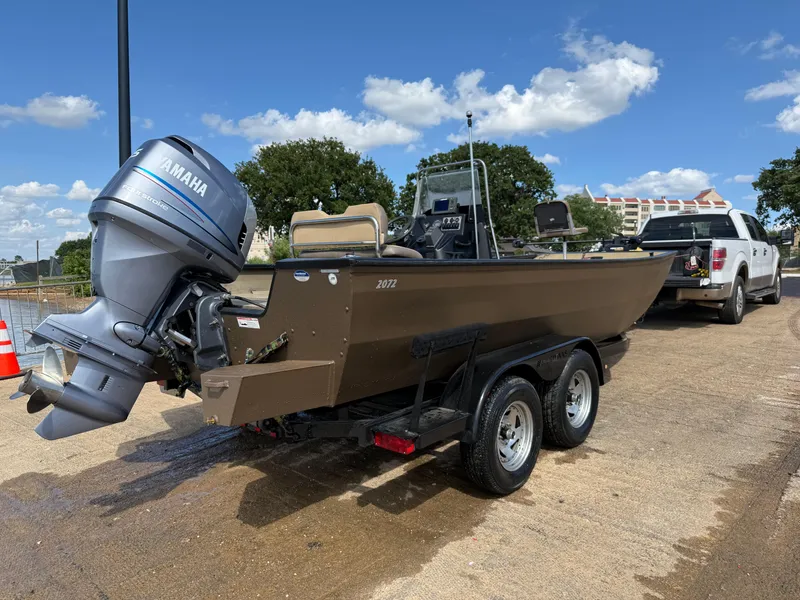 Slide: The Image of 2011 G3 2072cc boat with Yamaha outboard motor on trailer, parked near water. - 42