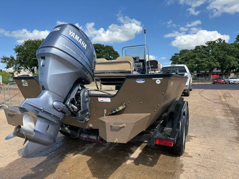 Slide: The Image of 2011 G3 2072cc boat with Yamaha outboard motor on a trailer, parked outdoors. - 43