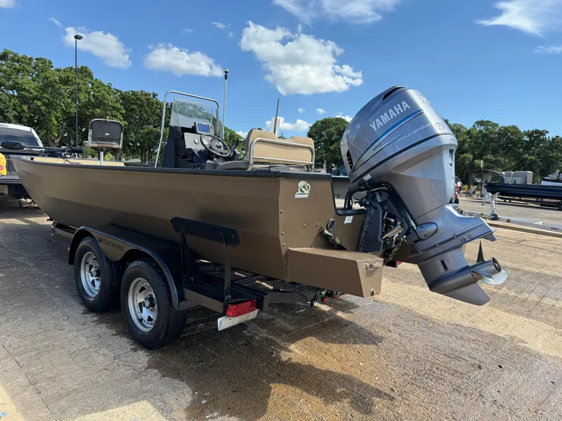 Slide: The Image of Boat on trailer with Yamaha outboard motor, G3 2072cc, 2011 model, parked outdoors. - 46