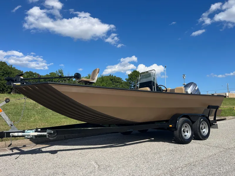 Slide: The Image of 2011 G3 2072cc boat on trailer under clear blue sky. - 7