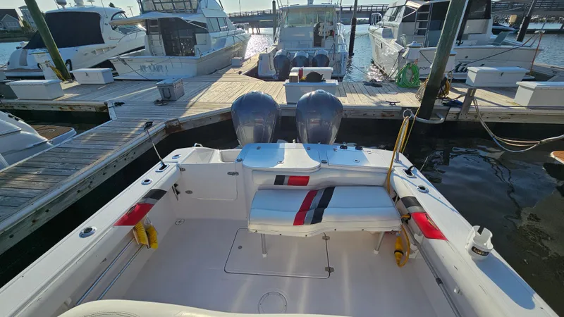 Slide: The Image of 1999 Donzi 35 ZF boat docked at marina with twin engines. - 11