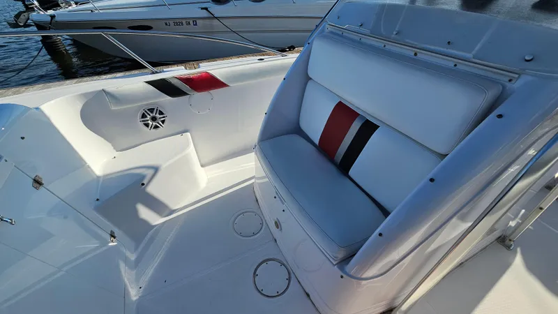 Slide: The Image of 1999 Donzi 35 ZF boat interior with white seating and red-black accents. - 21