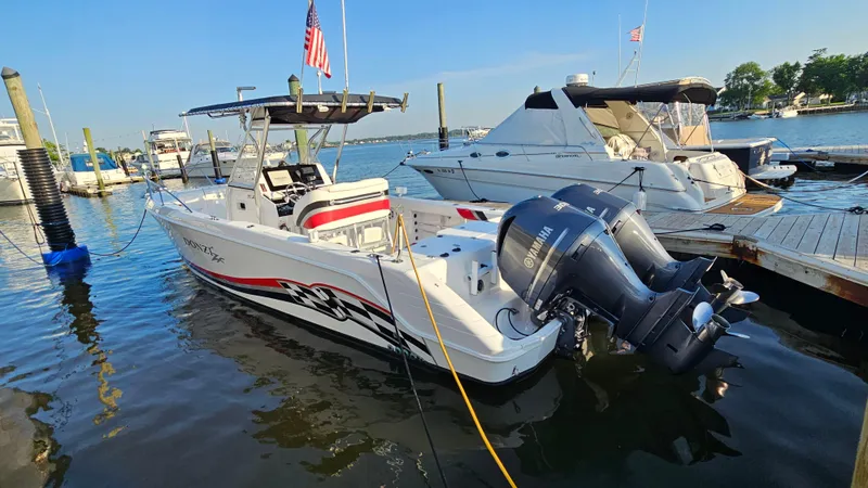 Slide: The Image of 1999 Donzi 35 ZF boat docked with twin Yamaha outboard engines. - 7