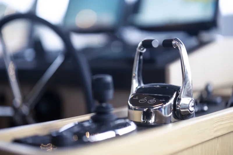 Slide: The Image of Control panel of 2026 Beneteau Swift Trawler 54, featuring modern navigation equipment. - 11