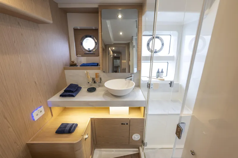 Slide: The Image of Luxurious bathroom in 2026 Beneteau Swift Trawler 54, featuring modern fixtures and elegant design. - 30