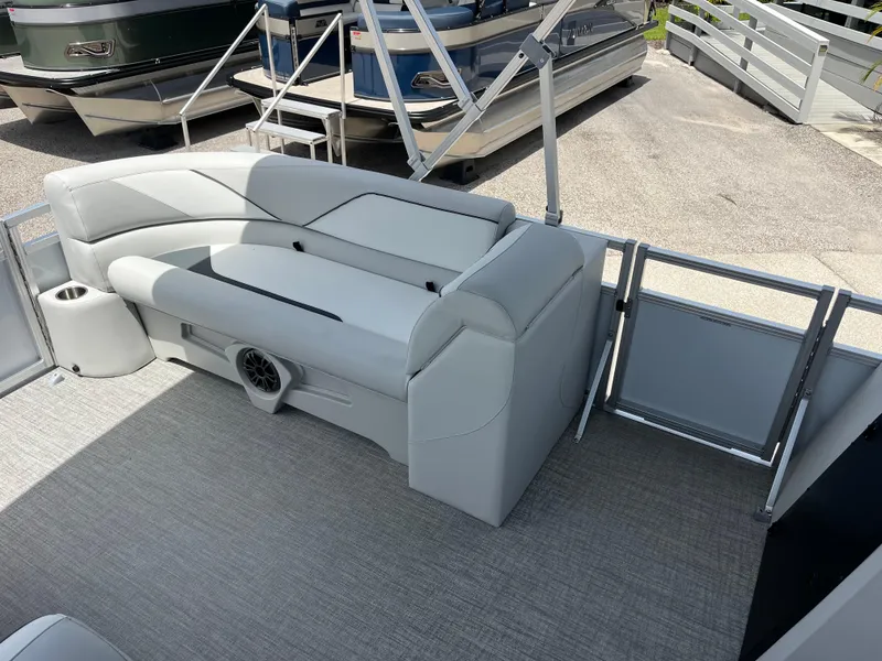 Slide: The Image of 2025 Avalon 2385 Venture 85 Tri Toon boat interior with gray seating and flooring. - 12