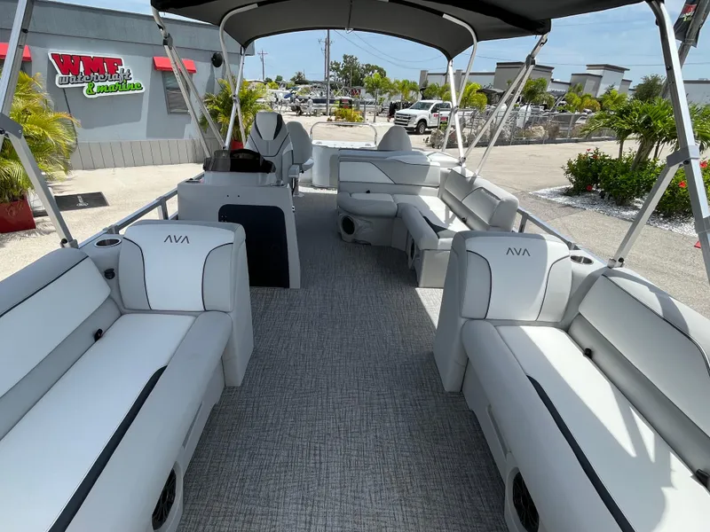 Slide: The Image of 2025 Avalon 2385 Venture 85 Tri Toon boat interior with plush seating and canopy. - 14