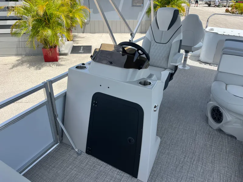 Slide: The Image of 2025 Avalon 2385 Venture 85 Tri Toon boat interior with helm and seating. - 15