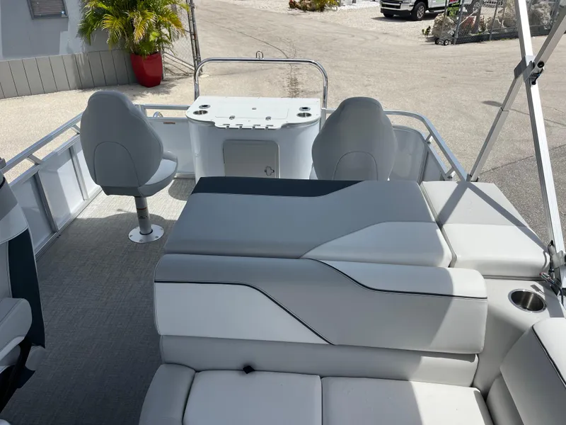 Slide: The Image of 2025 Avalon 2385 Venture 85 Tri Toon boat interior with seating and fishing setup. - 18