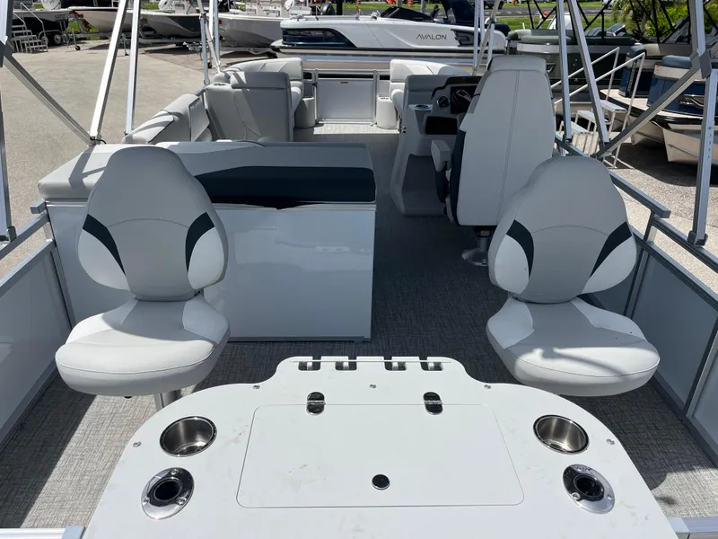 Slide: The Image of 2025 Avalon 2385 Venture 85 Tri Toon boat interior with seating and fishing setup. - 9