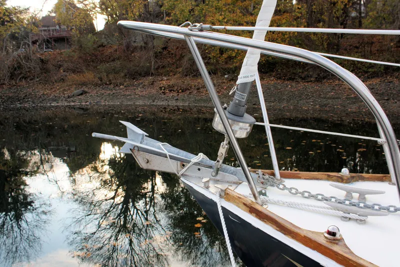 Slide: The Image of Bow of a 1976 Bristol 34 sailboat with anchor, reflected in calm water. - 23