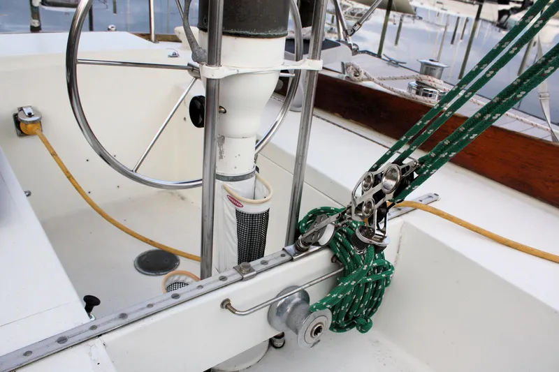 Slide: The Image of 1976 Bristol 34 sailboat cockpit with steering wheel and rigging details. - 30