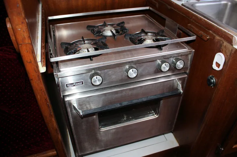 Slide: The Image of 1976 Bristol 34 boat kitchen with stainless steel stove and oven. - 45