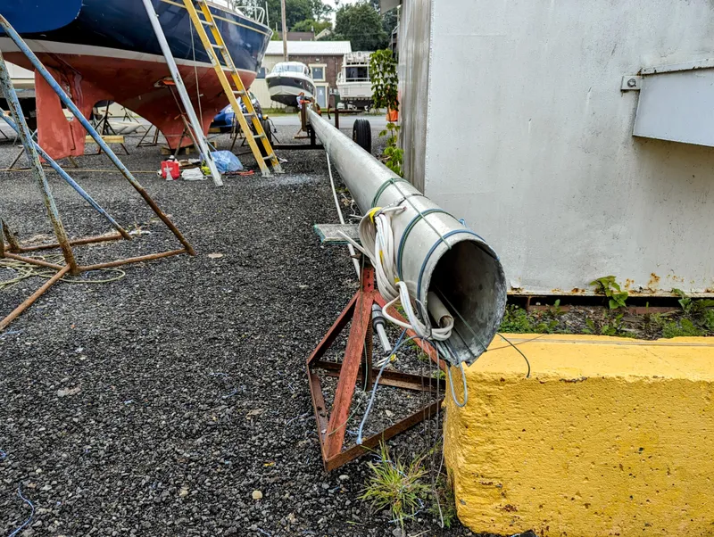 Slide: The Image of Boatyard with Bristol 34 sailboat mast on stand, 1976 model. - 6