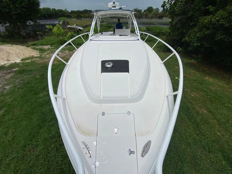 Slide: The Image of 2008 Intrepid 390 Sport Yacht on grassy area, viewed from bow. - 12