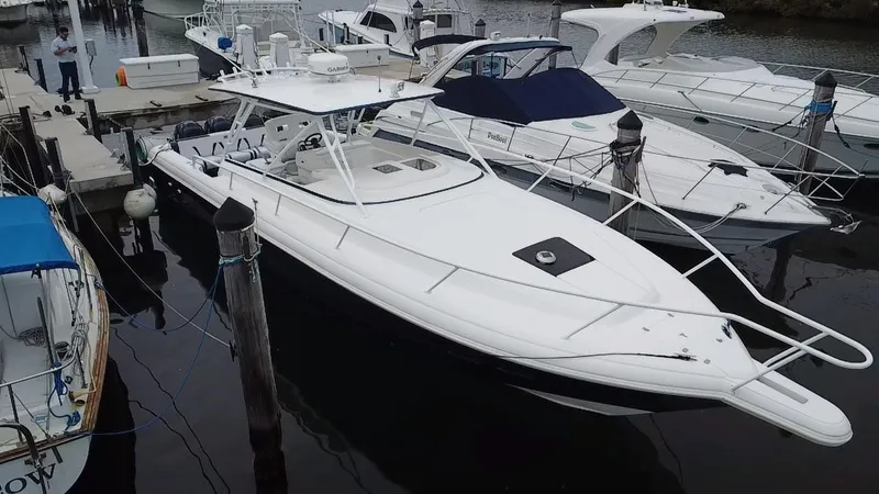 Slide: The Image of 2008 Intrepid 390 Sport Yacht docked at marina. - 16