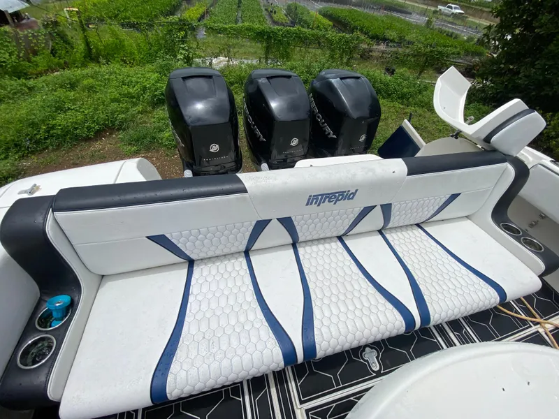 Slide: The Image of 2008 Intrepid 390 Sport Yacht with triple Mercury outboard engines and stylish seating. - 25