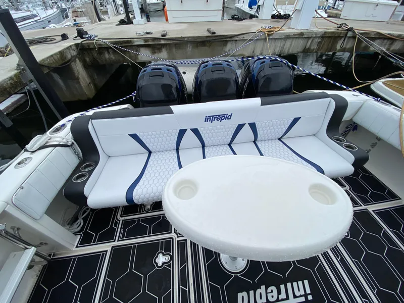 Slide: The Image of 2008 Intrepid 390 Sport Yacht with triple outboard engines and rear seating. - 26