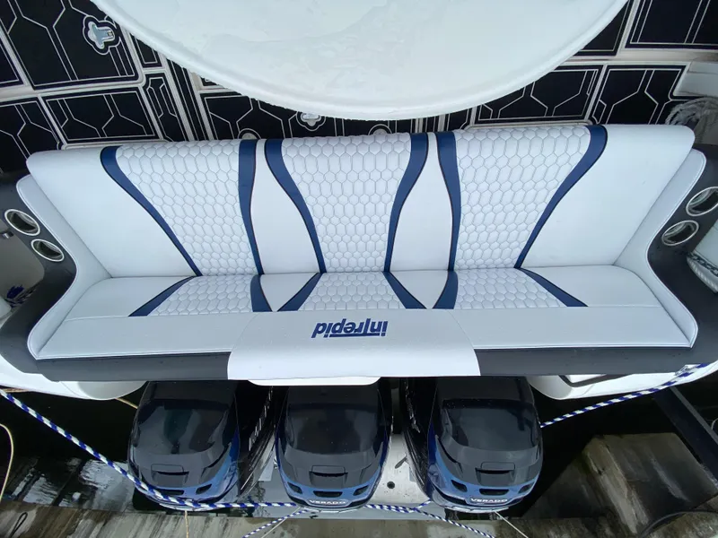 Slide: The Image of 2008 Intrepid 390 Sport Yacht rear seating with triple outboard engines. - 27