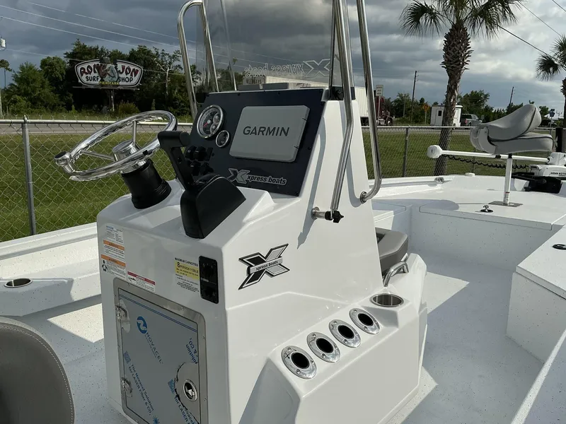 Slide: The Image of 2026 Xpress Hyper-Lift Series H22B boat console with Garmin system and steering wheel. - 10