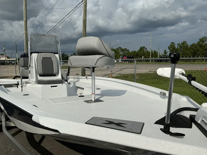 Slide: The Image of 2026 Xpress Hyper-Lift Series H22B boat with seating and equipment, under cloudy sky. - 3