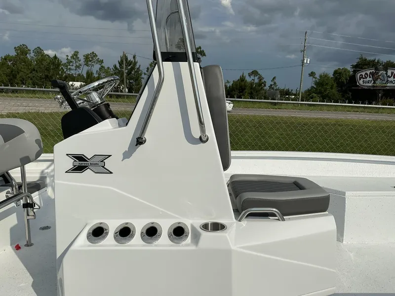 Slide: The Image of 2026 Xpress Hyper-Lift Series H22B boat console with seating and steering wheel. - 7