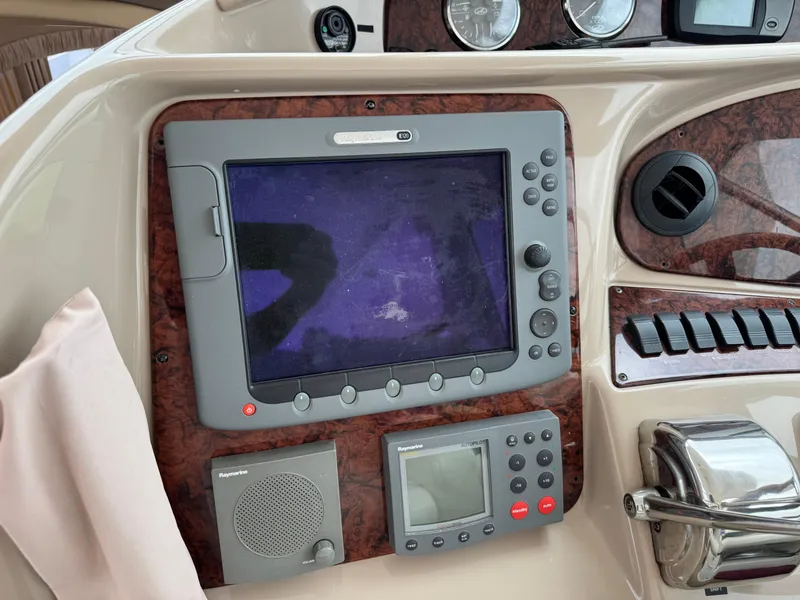 Slide: The Image of Control panel of a 2004 Sea Ray 390 Motoryacht with navigation and communication equipment. - 10