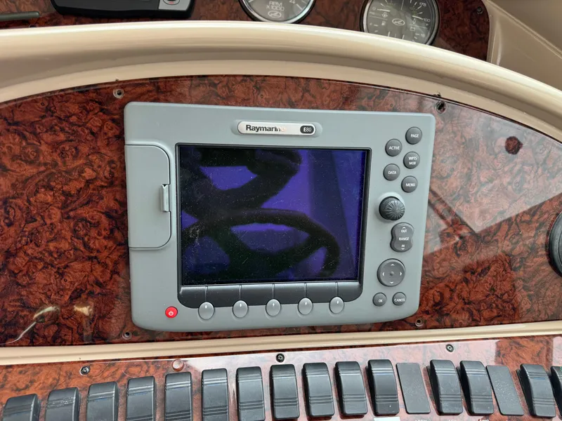 Slide: The Image of Raymarine E80 navigation system on 2004 Sea Ray 390 Motoryacht dashboard. - 11