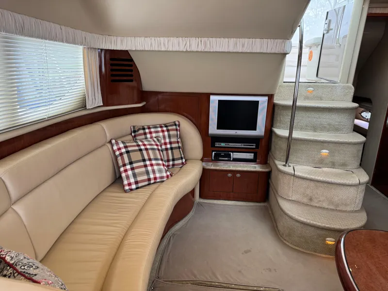 Slide: The Image of Luxurious interior of 2004 Sea Ray 390 Motoryacht with plush seating and entertainment system. - 18