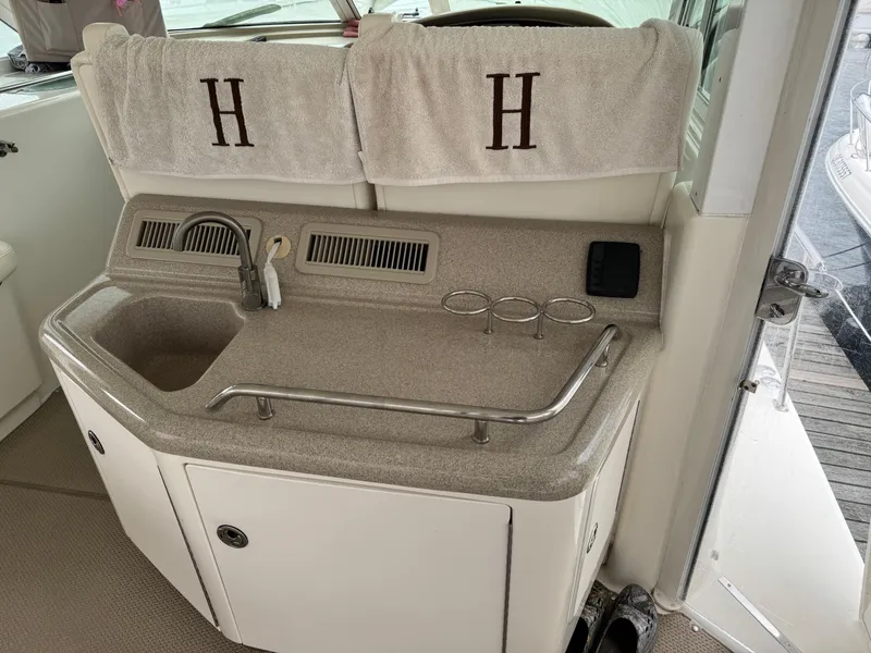 Slide: The Image of 2004 Sea Ray 390 Motoryacht interior with sink and towel rack. - 6