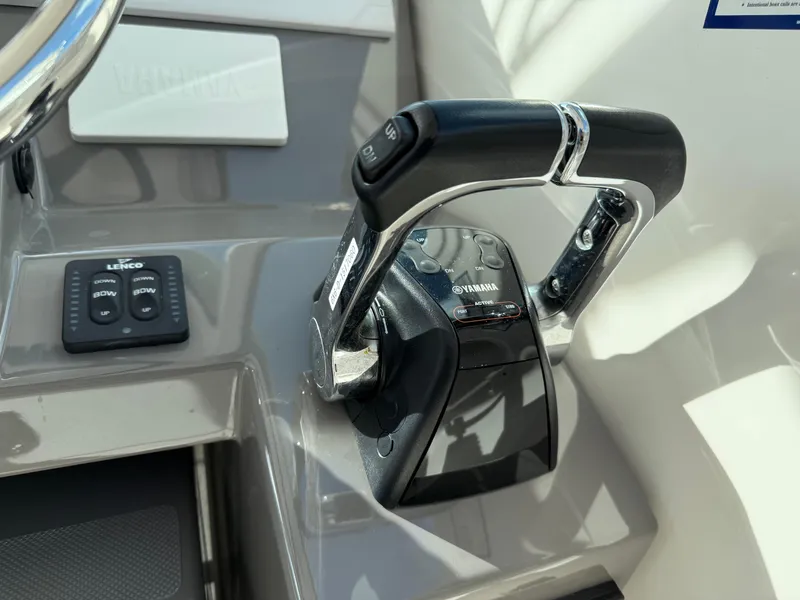 Slide: The Image of 2017 Pursuit DC 325 Dual Console helm with dual Simrad displays and steering wheel. - 36