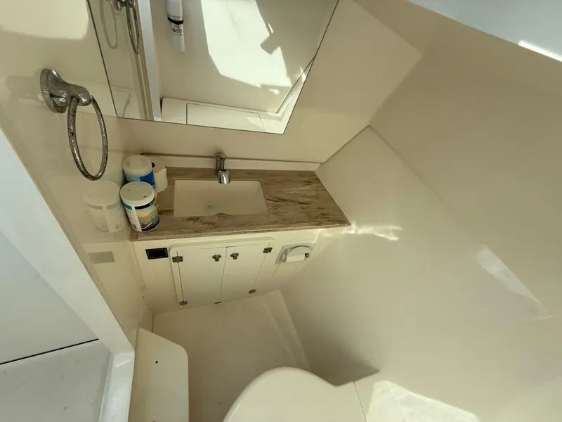 Slide: The Image of Interior view of 2017 Pursuit DC 325 Dual Console boat at marina. - 43