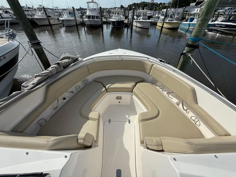 Slide: The Image of 2017 Pursuit DC 325 Dual Console boat docked among other vessels. - 46