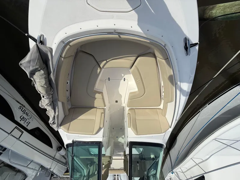 Slide: The Image of Anchor compartment of 2017 Pursuit DC 325 Dual Console boat, showing chain and winch system. - 47